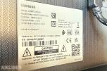 Samsung 65” TV med gulvstativ på hjul og fjernkontroll