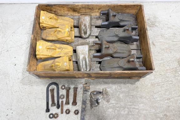 Gravemaskintenner og tannholdere