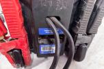 Parti med batteriladere, startbooster og startkabler