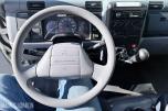 2010 Mitsubishi Fuso skapbil med løftelem og sidedør